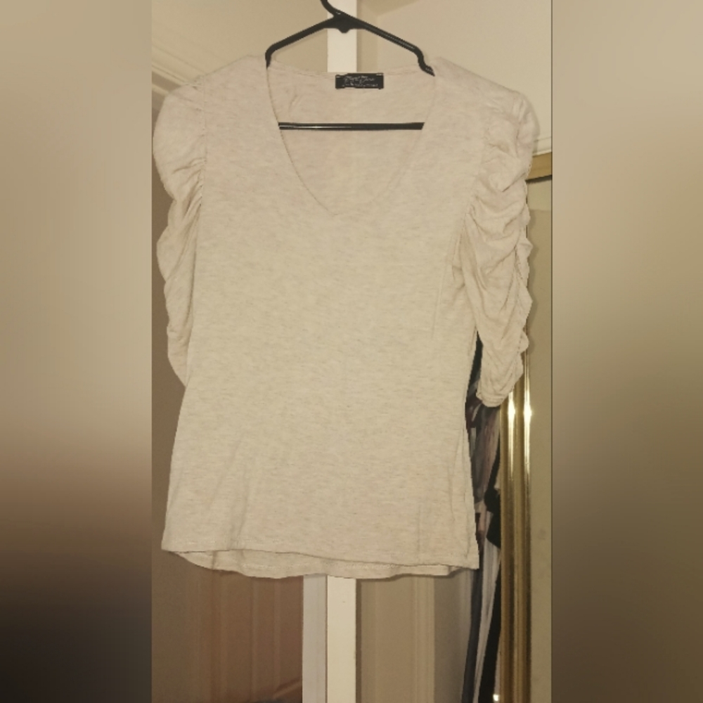 3/4 runched sleeve double lined in the front to provide coverage, modest top